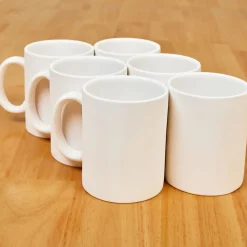 Colorations® Decorative Mugs and Plates set of 12
